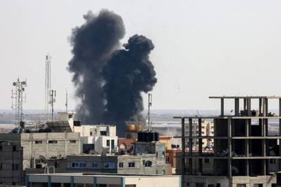 Smoke billows from a building struck during an Israeli air strike in Rafah in the southern Gaza Strip. Israel bombarded Islamic Jihad positions in the Gaza Strip for a third day, with 31 Palestinians killed. AFP