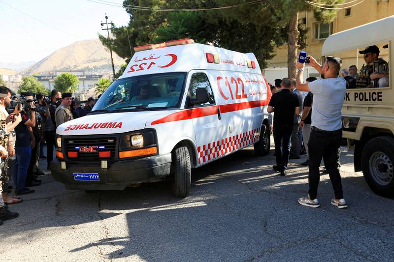 An ambulance transports a coffin of an Iraqi who was killed in what Iraq claims was a Turkish attack on a mountain resort in the northern province of Dohuk. Reuters