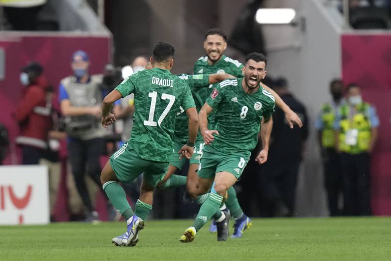 Algeria's Amir Sayoud, right, celebratesafter scoring. AP