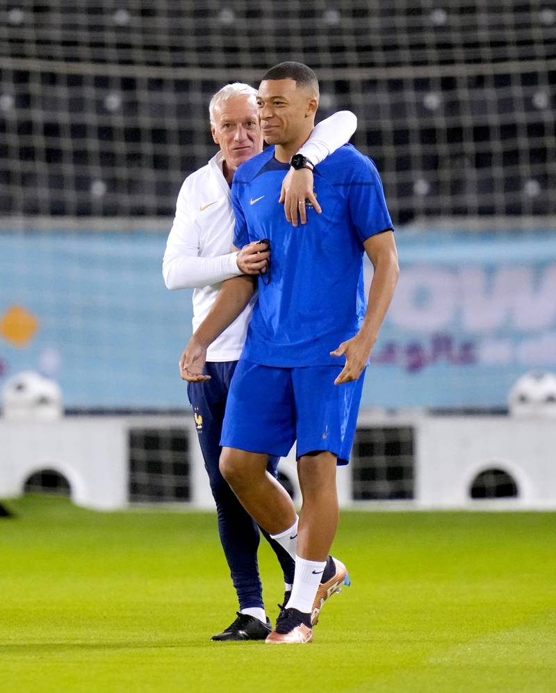 France's Kylian Mbappe with manager Didier Deschamps. PA