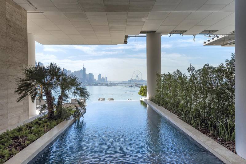 An infinity edge pool has a view to Dubai Marina. Courtesy Gulf Sotheby's International Realty