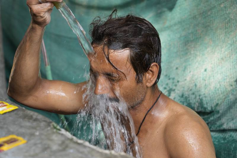 A man cools down on a hot summer afternoon in Lucknow, in the central Indian state of Uttar Pradesh. AP Photo