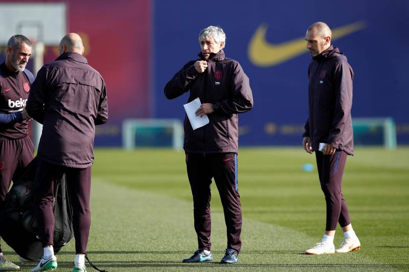 Barcelona manager Quique Setien and his staff at the beginning on the training session. Reuters