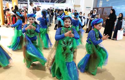 ABU DHABI,  UNITED ARAB EMIRATES , April 24 – 2019 :- School students performing folk dance at the Indian Stand at the Abu Dhabi International Book Fair held at Abu Dhabi National Exhibition Centre in Abu Dhabi. ( Pawan Singh / The National ) For News/Online/Instagram. Story by Rupert