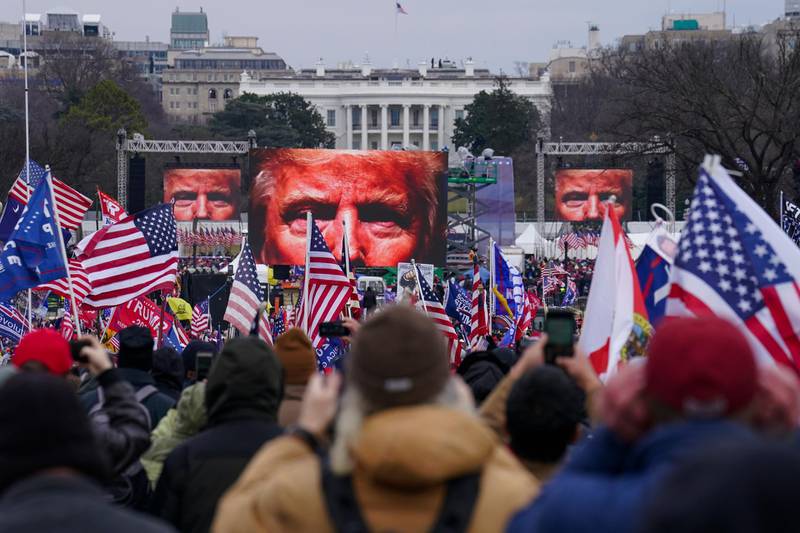 FILE - In this Jan. 6, 2021, file photo, Trump supporters participate in a rally in Washington. Far-right social media users for weeks openly hinted in widely shared posts that chaos would erupt at the U.S. Capitol while Congress convened to certify the election results. Selena Gomez is laying much of the blame for the violent attack on the U.S. Capitol at the feet of Big Tech. The singer told the leaders of Facebook, Twitter, Google and YouTube that they've allowed "people with hate in their hearts" to thrive and therefore "failed all the American people." It's just the latest in the 28-year-old Gomez's efforts to draw attention to the dangers of internet companies. In an exclusive interview with The Associated Press, Gomez explains why she's so passionate about the issue and what she's done both publicly and behind the scenes to get her message across. (AP Photo/John Minchillo, File)