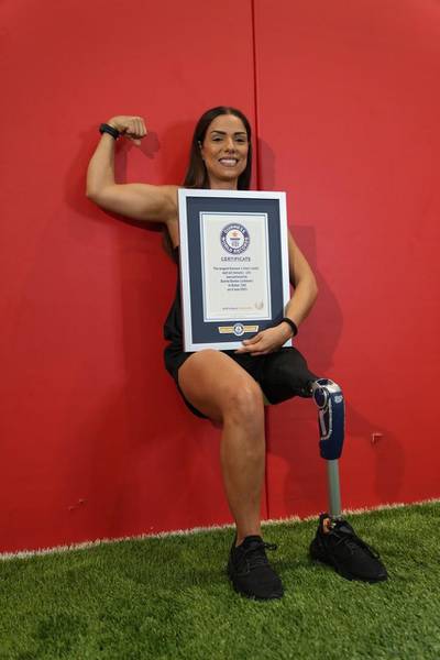 Lebanese athlete Dareen Barbar broke the Guinness World Record for the longest Samson's chair / static wall sit (female), with a 2:08:24 minute sit. Courtesy Guinness World Record