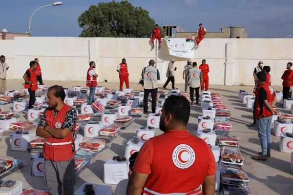 Libyan Red Crescent members after an Emirates Red Crescent aid lorry arrived in Karsa, following the floods in Derna. Reuters