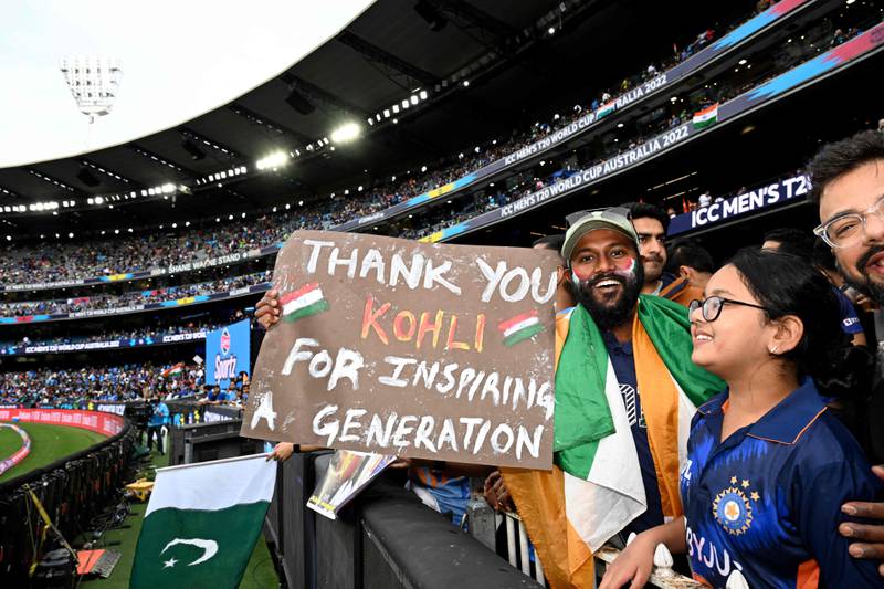India fans cheer on their team at the MCG. AFP