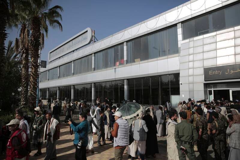 Yemenis gather at the capital's airport ahead of the prisoner exchange. AP Photo