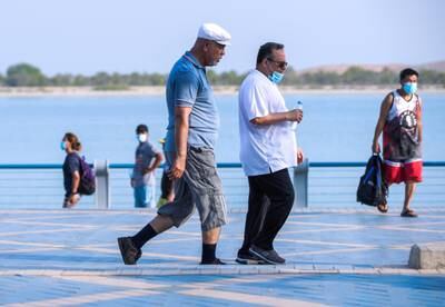 Abu Dhabi, United Arab Emirates, July 11, 2020.     Friends walk down the Corniche to get some exercise during the Coronavirus pandemic.Victor Besa  / The NationalSection:  StandaloneReporter: