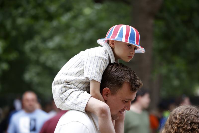 A young royal fan has a good view of proceedings along The Mall, outside Buckingham Palace, in central London. AP