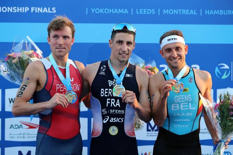 Leo Bergere, centre, Morgan Pearson, left, and Jelle Geens at the World Triathlon Championship Finals podium