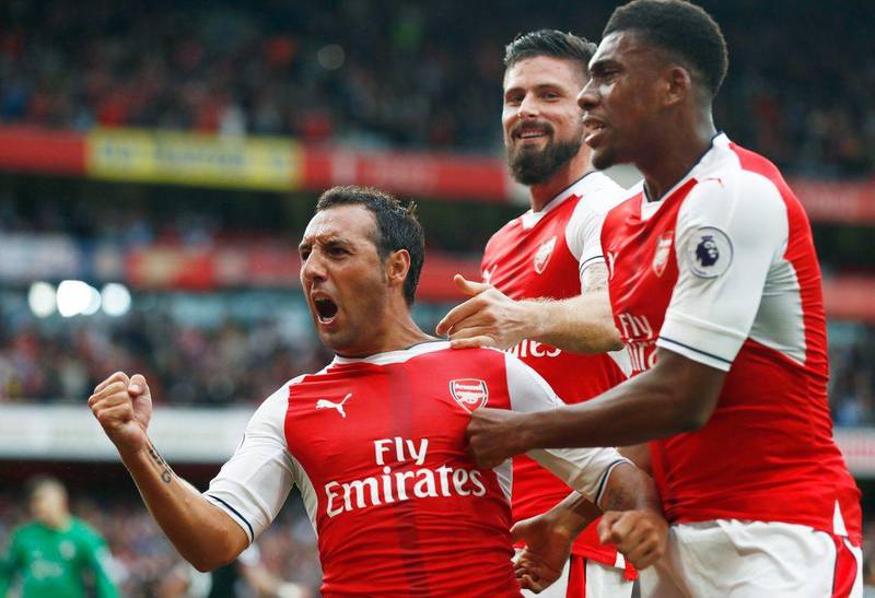 Santi Cazorla, left, celebrates after scoring the winning goal from the penalty spot against Southampton. Clive Rose / Getty Images