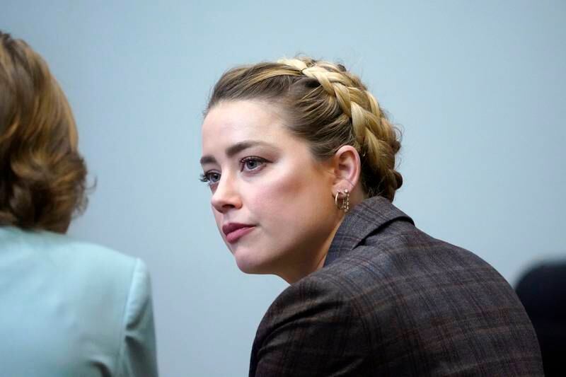 US actress Amber Heard listens to her attorney in the courtroom at the Fairfax County Circuit Court in Fairfax, Virginia. EPA