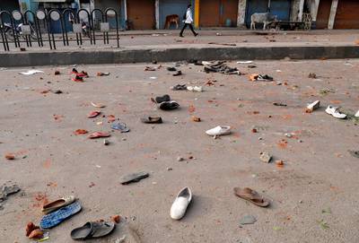 The shoes of demonstrators are seen scattered along a road after a protest against a new citizenship law, in Lucknow, India, December 19, 2019. Reuters