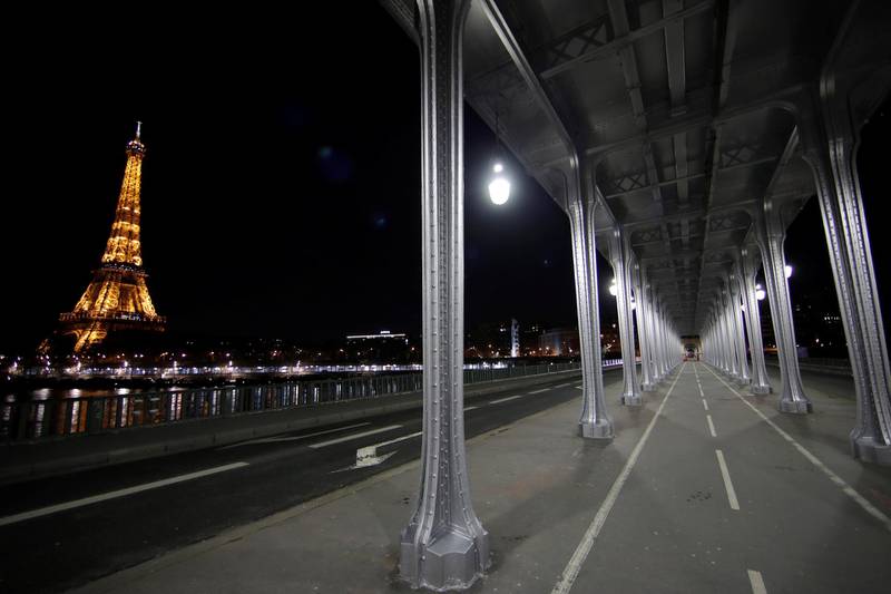 A view shows the deserted Pont de Bir-Hakeim Bridge and the Eiffel Tower during a nationwide curfew, from 6pm to 6am, in Paris, France. Reuters