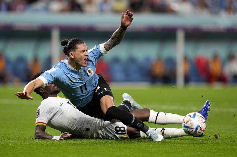 Ghana's Daniel Amartey tackles Uruguay attacker Darwin Nunez. AP
