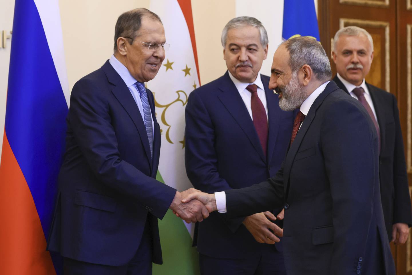 Russian Foreign Minister Sergei Lavrov, left, and Armenia's Prime Minister Nikol Pashinyan shake hands ahead of a meeting of the CSTO in Yerevan, Armenia, on June 10. AP
