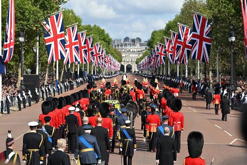 The cortege makes its way along The Mall from Buckingham Palace. Getty