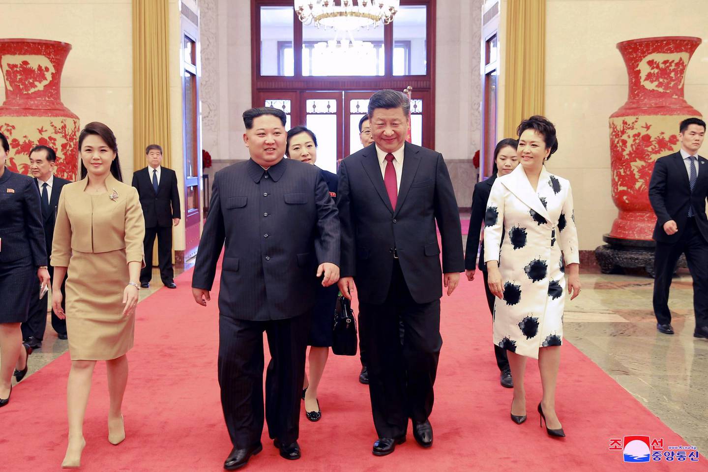 epa06633682 An undated photo released on 28 March 2018 by the North Korean Central News Agency (KCNA), the state news agency of North Korea, shows North Korean leader Kim Jong-un (C-L) and his wife Ri Sol-ju (L) walking with Chinese President Xi Jinping (C-R) and his wife Peng Liyuan (R) during their meeting in China. According to the North Korean media, Kim Jong-un visited China from 25 to 28 March at the invitation of Chinese President Xi Jinping.  EPA/KCNA   EDITORIAL USE ONLY