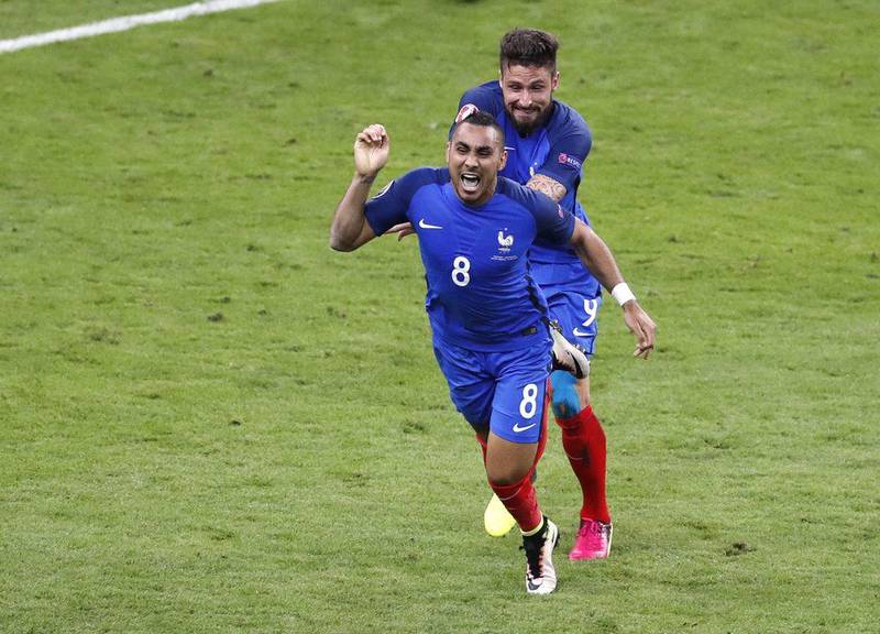 France's Dimitri Payet, left, celebrates with his teammate Olivier Giroud after scoring his side's second goal against Romania in the Euro 2016 opener on Friday night in Paris. Michael Sohn / AP / June 10, 2016  