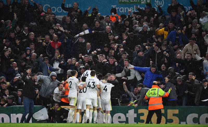Stuart Dallas is mobbed by Leeds teammates after scoring their second goal. Reuters