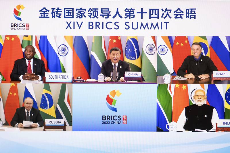 Chinese President Xi Jinping appears on a screen with South African President Cyril Ramaphosa, Brazilian President Jair Bolsonaro, Russian President Vladimir Putin and Indian Prime Minister Narendra Modi as he hosts the 14th Brics Summit via video link from Beijing on June 23. Iran has applied to join Brics, its foreign ministry said. Xinhua News Agency/AP