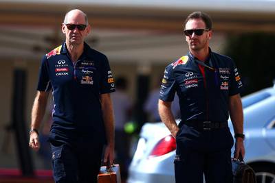 Infiniti Red Bull Racing Team Principal Christian Horner and Adrian Newey, the Chief Technical Officer, arrive in the paddock before final practice ahead of the 2014 Abu Dhabi Formula One Grand Prix. Clive Mason / Getty Images