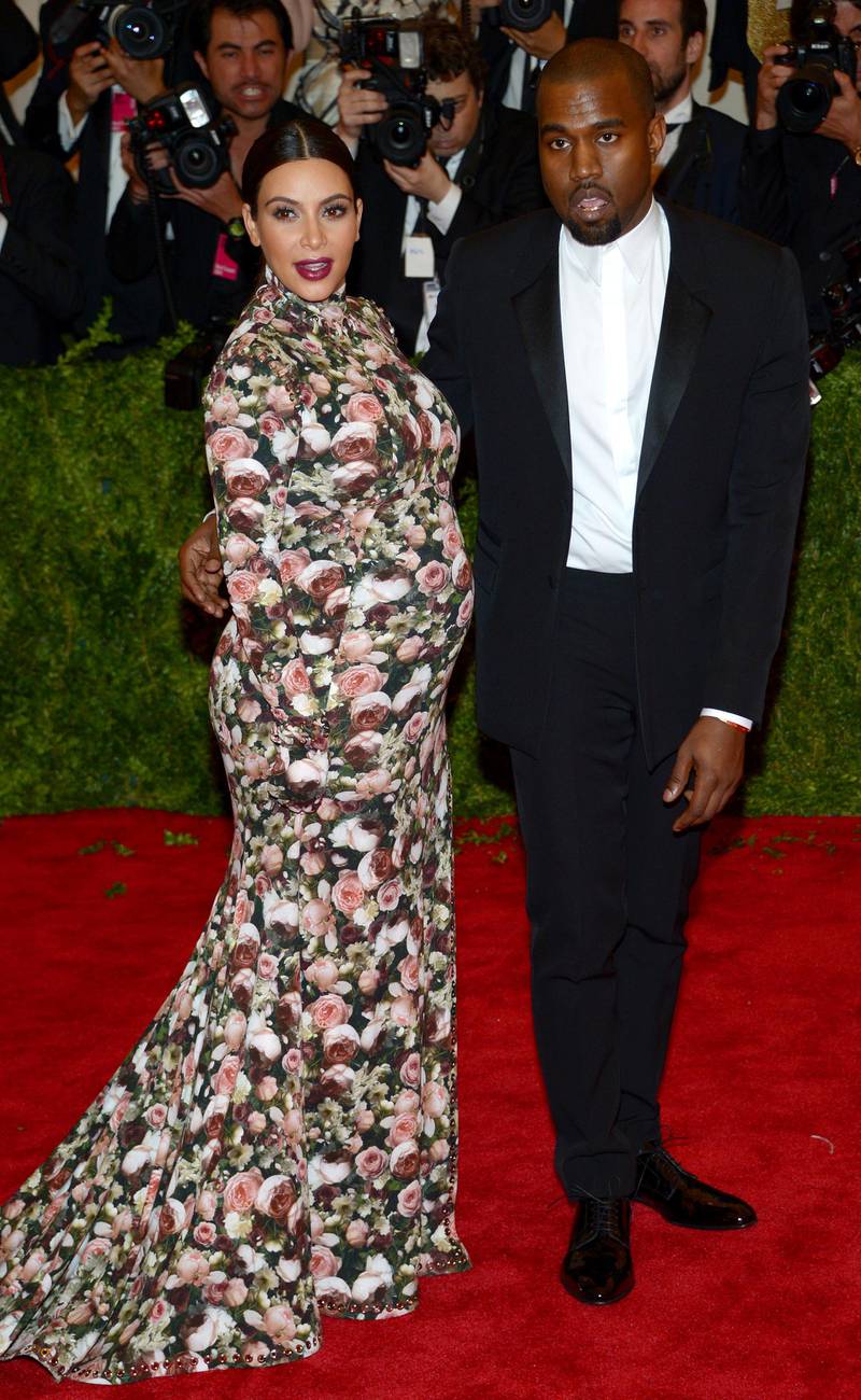 epa03747839 (FILE) A file picture dated 06 May 2013 shows US cocialite Kim Kardashian (L) and musician Kanye West (R) attending the 'Punk: Chaos to Couture' Costume Institute Gala at the Metropolitan Museum of Art in New York, New York, USA. According to media reports on 16 June 2013, Kim Kardashian gave birth to a baby girl on 15 June 2013 at the Cedars Sinai Medical Center in Los Angeles. This is the first child for Kim Kardashian and Kanye West, her boyfriend.  EPA/JUSTIN LANE
