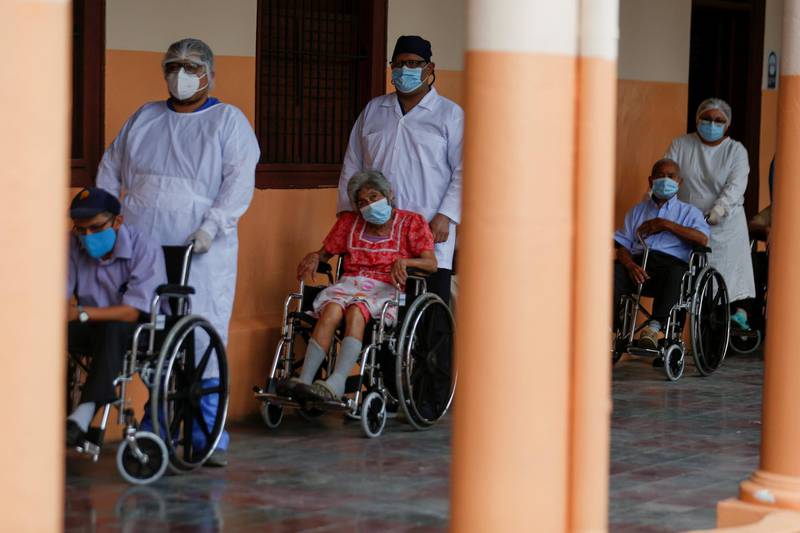 Elders wait in a line to get a dose of the Sinovac's CoronaVac coronavirus disease vaccine in a nursing home in San Salvador, El Salvador. Reuters