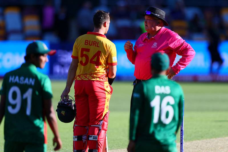Zimbabwe's Ryan Burl talks to umpire Marais Erasmus during the match against Bangladesh. AFP
