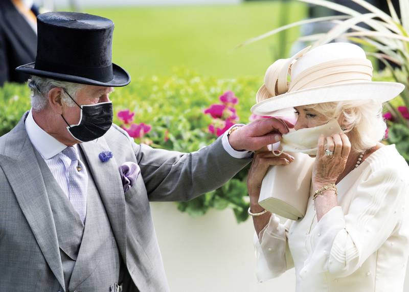 The photo chosen by Britain's Prince Charles and Camilla, Duchess of Cornwall for their Christmas card, was taken at Royal Ascot this year. Clarence House via AP