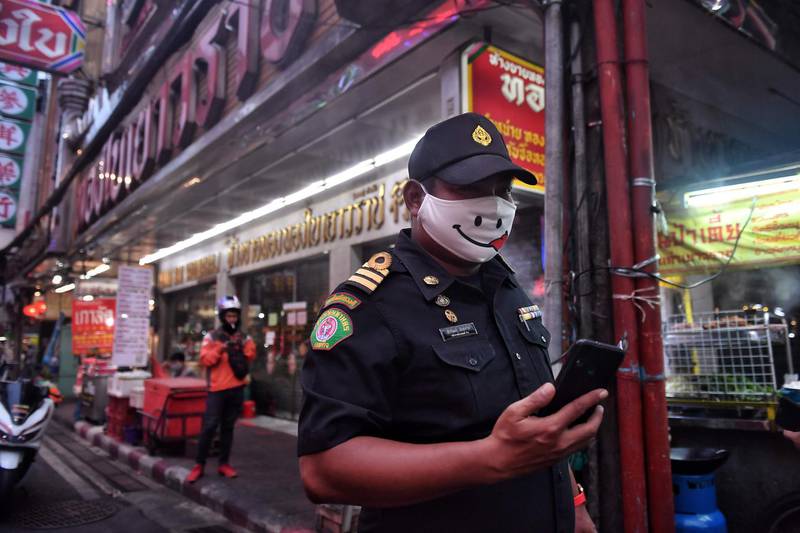 A policeman patrols Chinatown in Bangkok, Thailand. AFP