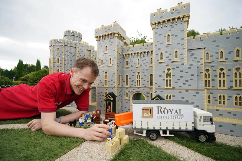 Legoland Windsor Resort model maker Will Metcalfe finalised the display of Lego figures of the Duke and Duchess of Cambridge on Tuesday, to celebrate the royal couple moving to the area. PA