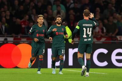 Mohamed Salah celebrates with teammates after scoring the opening goal. Getty