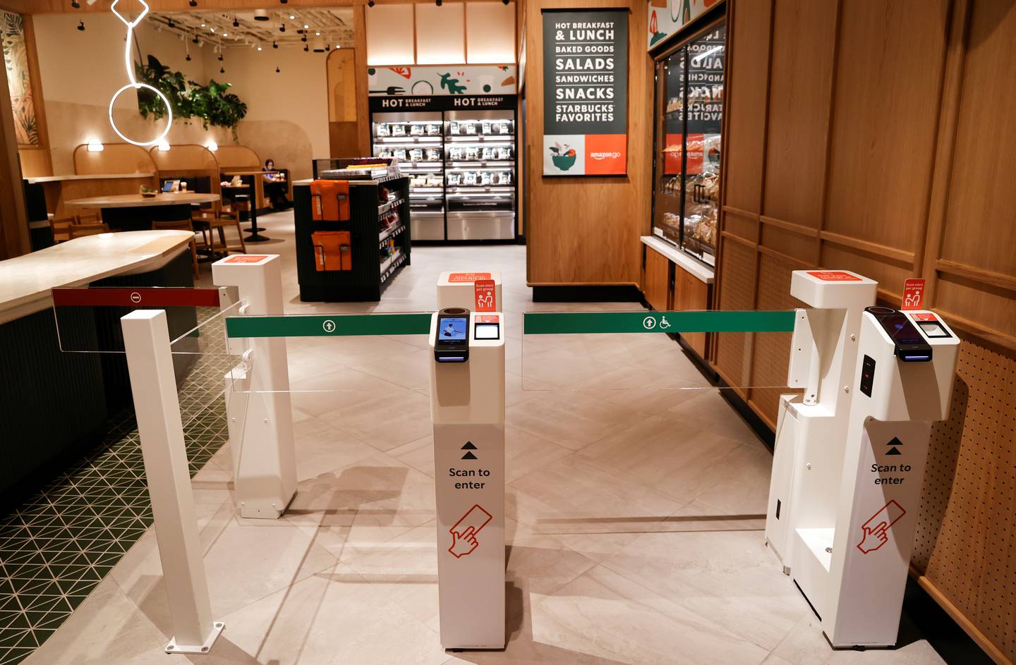 The entrance turnstiles of a new Starbucks outlet, its first in partnership with Amazon Go that lets customers check out without a cashier, in New York. Reuters