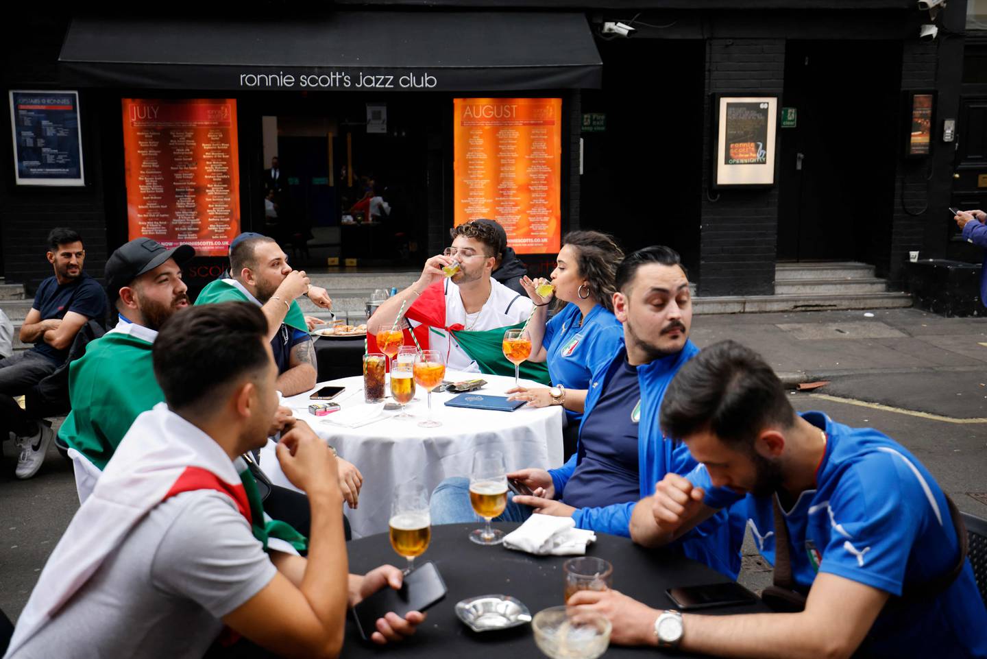 Italian football fans enjoy a drink before the recent Euro 2020 final at Wembley. AFP

