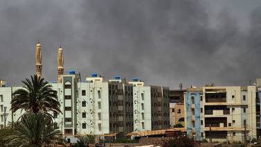 Smoke rises above buildings in Sudan's capital Khartoum on Saturday, five days into a one-week ceasefire. AFP