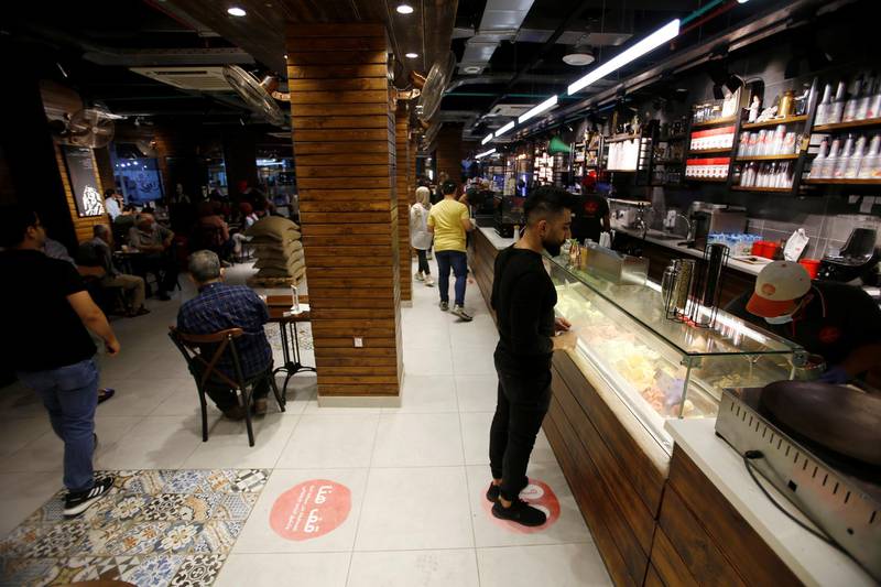 People visit a cafe that reopened after restrictions were eased in Baghdad, Iraq. Reuters