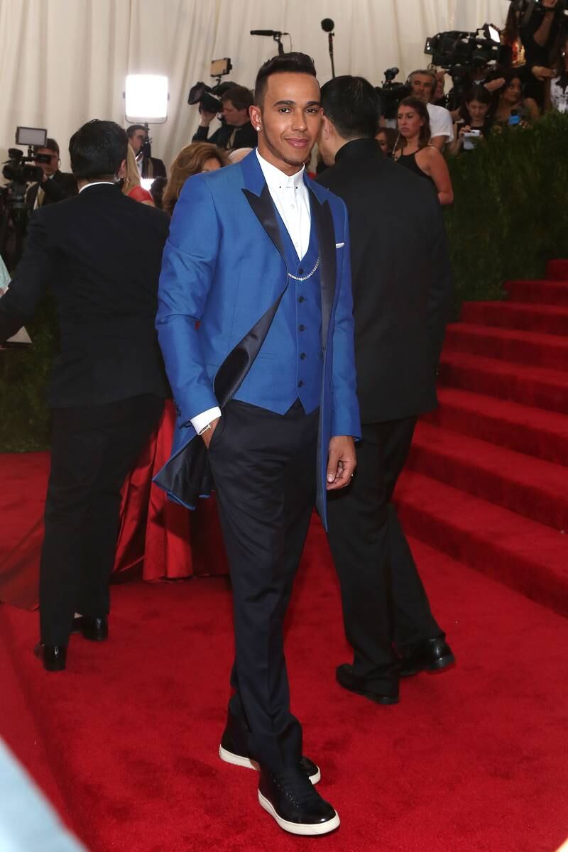 Lewis Hamilton, in a blue Topman tuxedo, attends the Met Gala at the Metropolitan Museum of Art on May 4, 2015, in New York City. FilmMagic