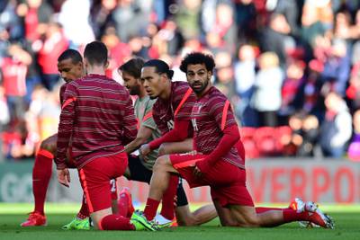 Liverpool's Mohamed Salah and Virgil van Dijk warm up before the match. AFP