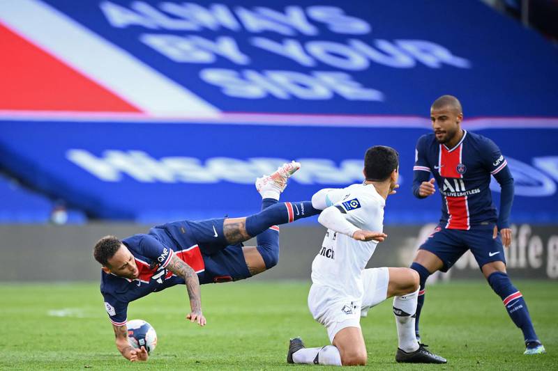Neymar is fouled by Lille's French midfielder Benjamin Andre. AFP