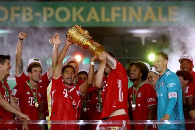 Serge Gnabry lifts the trophy. Getty