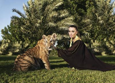 Roberta Mancino poses with a tiger as part of a campaign with the Emirates Park Zoo in Abu Dhabi. Massimiliano Haim / Caters News Agency