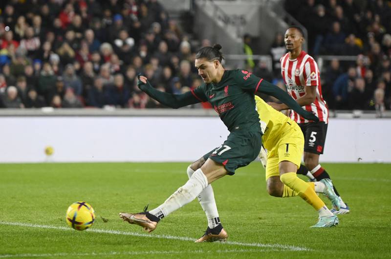 Liverpool striker Darwin Nunez rounds Bees goalkeeper David Raya but is denied a goal by a goal-line clearance by Men Mee. Reuters