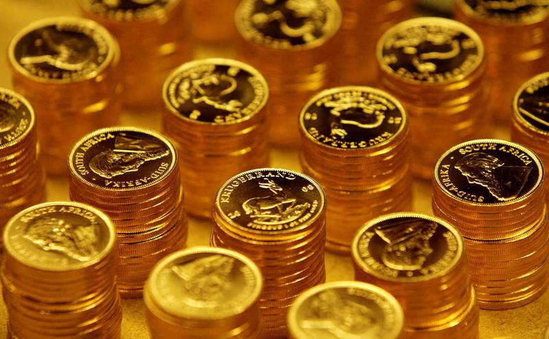 FILE PHOTO: Gold bullion coins known as Krugerrands are pictured in the mint where they are manufactured in Midrand outside Johannesburg October 3, 2008. REUTERS/Siphiwe Sibeko (SOUTH AFRICA)/File Photo