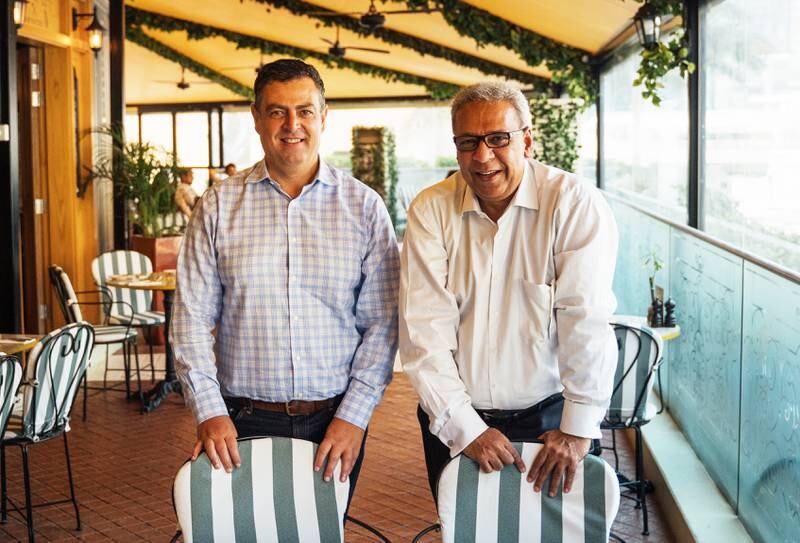 Cookbook author Flavel Monteiro, right, with Naim Maadad of Gates Hospitality