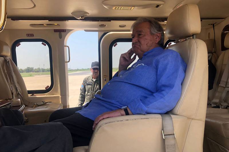 Mr Guterres sits in a helicopter during his visit to flood-affected areas in Pakistan's Sindh province. AFP