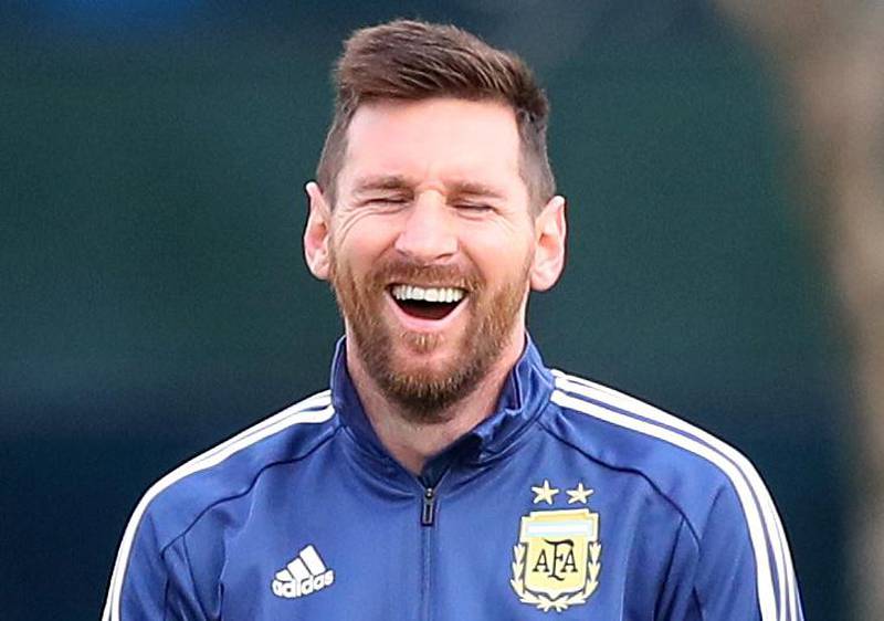 Argentina's Lionel Messi laughs during training. Reuters