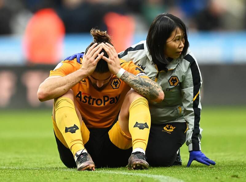 Wolves midfielder Ruben Neves receives medical attention. Getty
